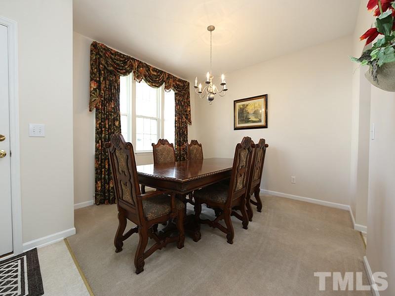 2304 Spruce Shadows Lane Raleigh, NC 27614 - Photo 3 of 25 a view of a dining room with furniture window and outside view