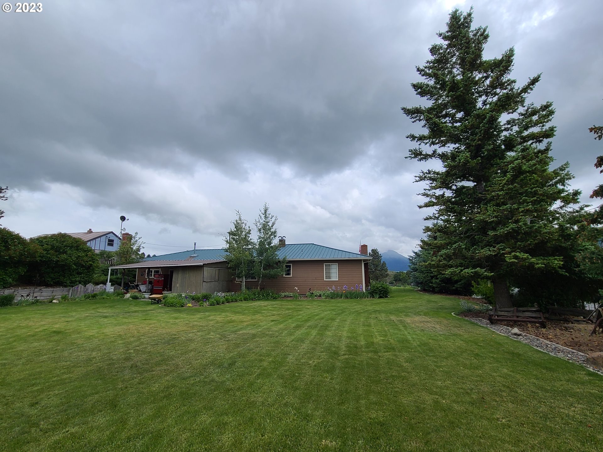 313 Northeast Garfield Street Enterprise, OR 97828 - Photo 12 of 24 a front view of house with a garden