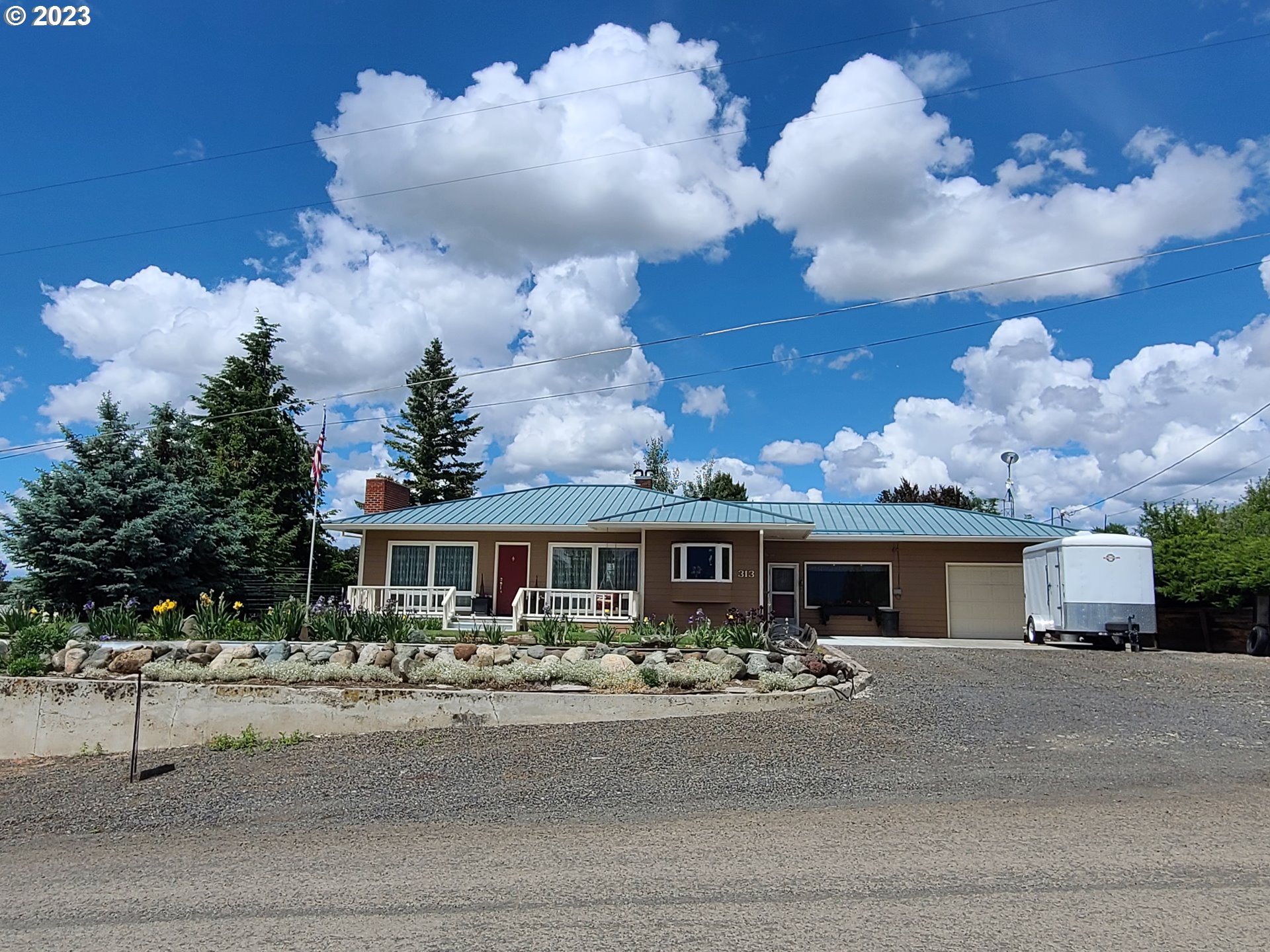 313 Northeast Garfield Street Enterprise, OR 97828 - Photo 15 of 24 a front view of house with a garden