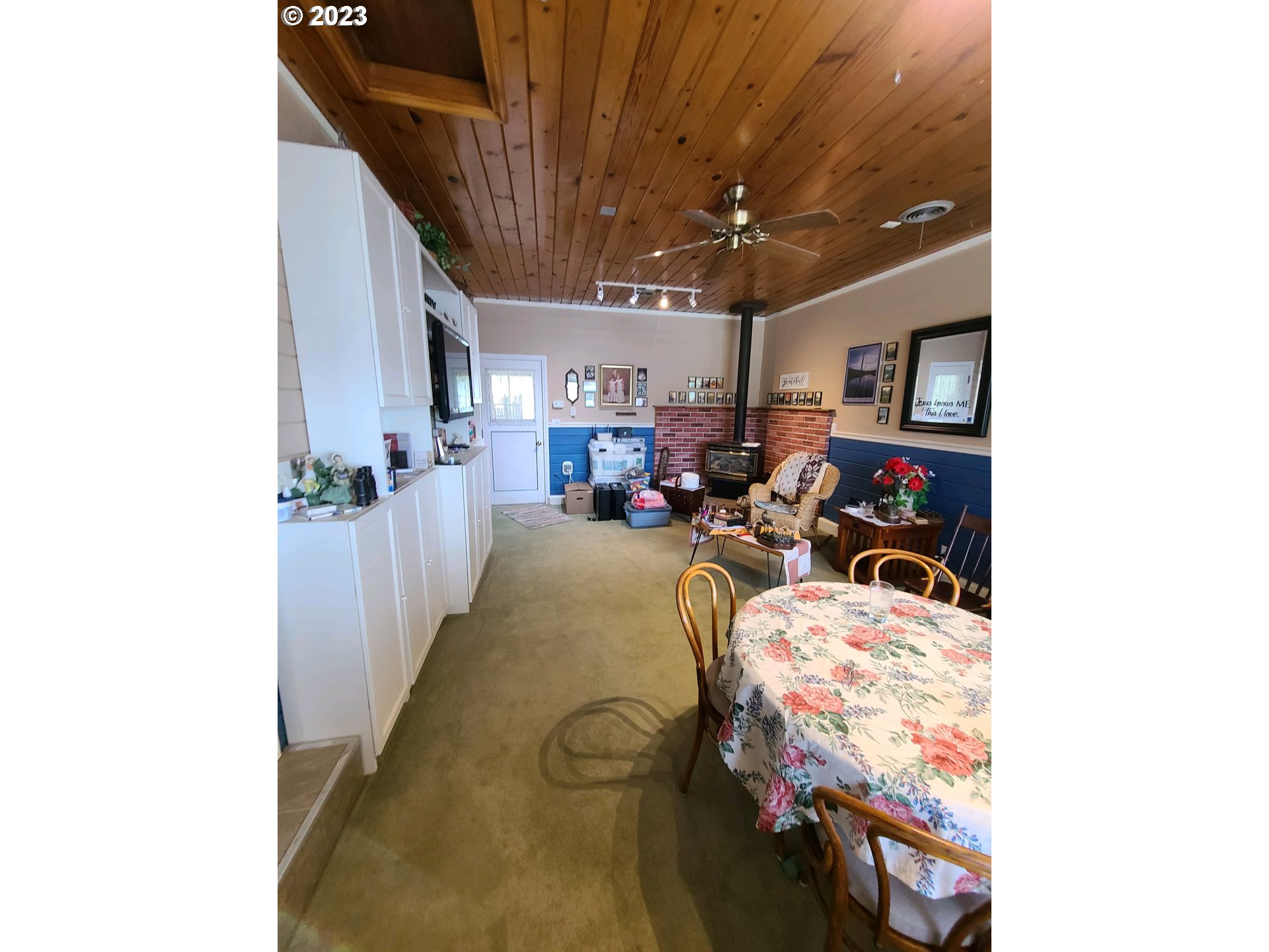 313 Northeast Garfield Street Enterprise, OR 97828 - Photo 19 of 24 a bed room with furniture and a chandelier