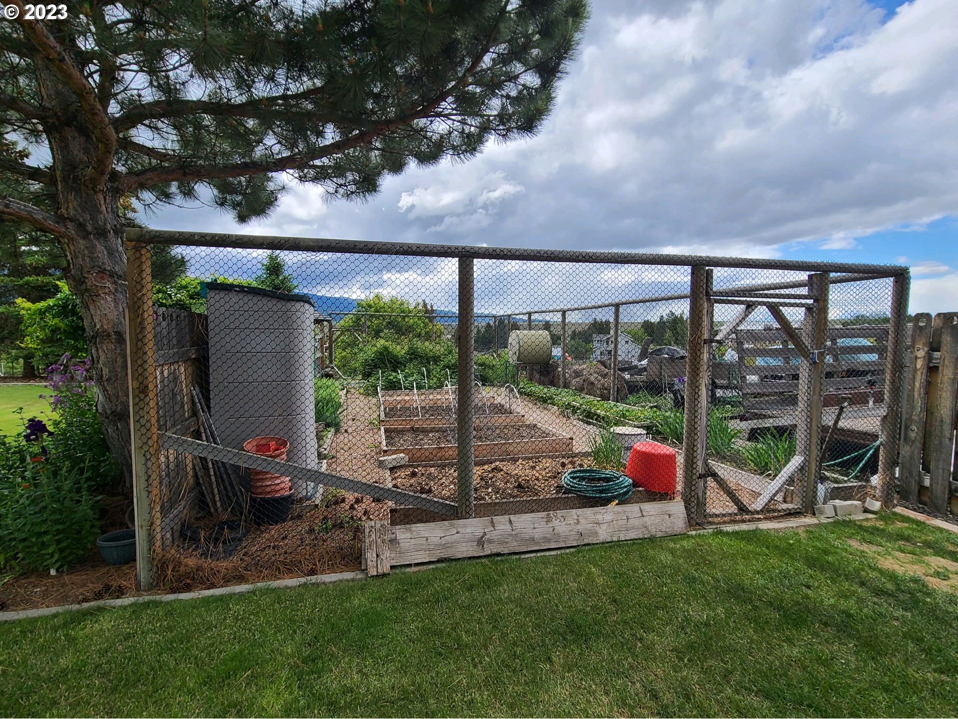 313 Northeast Garfield Street Enterprise, OR 97828 - Photo 20 of 24 a view of a house with backyard porch and sitting area