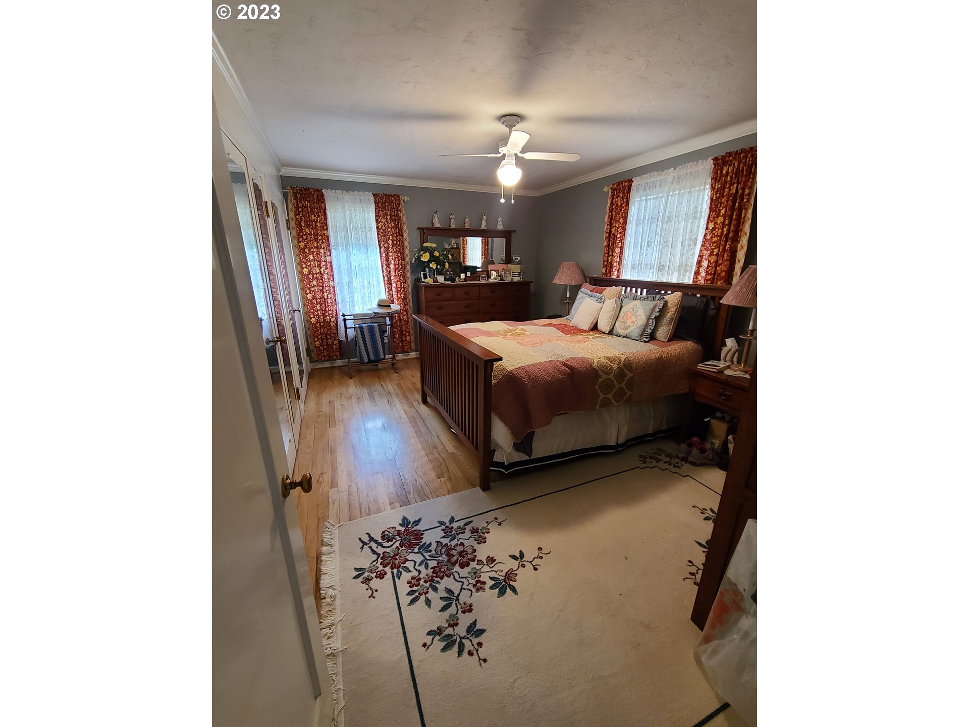 313 Northeast Garfield Street Enterprise, OR 97828 - Photo 6 of 24 a bedroom with a bed and a mirror