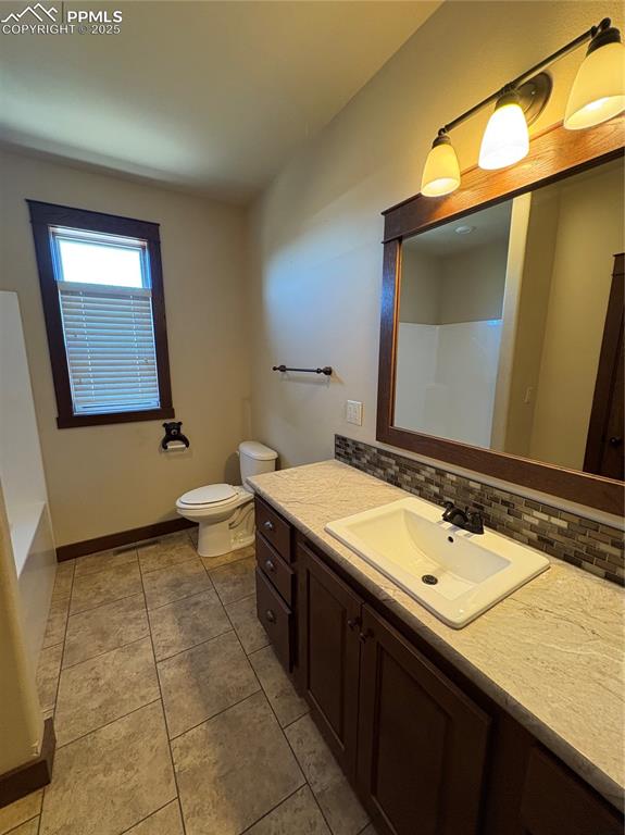 1925 Doe Valley Road Guffey, CO 80820 - Photo 15 of 30 a bathroom with a sink and a mirror