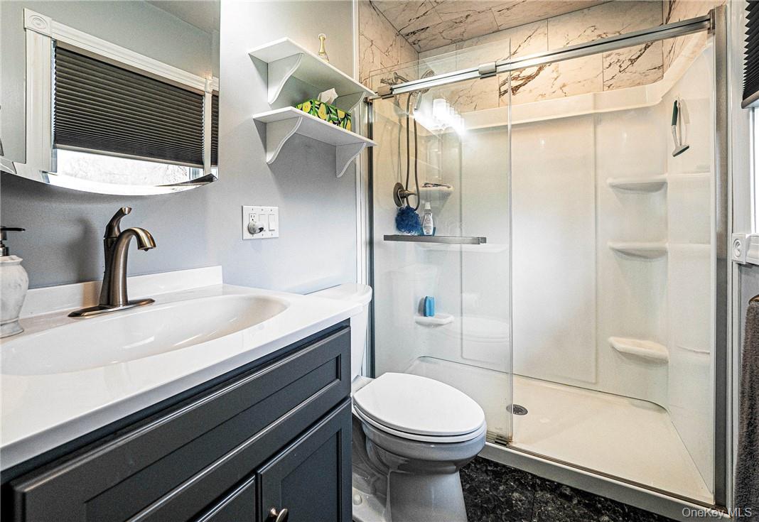 26 Waterbury Road Warwick, NY 10990 - Photo 14 of 30 a bathroom with a sink a toilet and shower