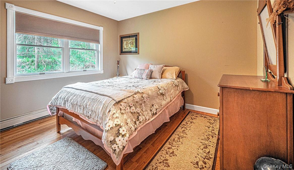 26 Waterbury Road Warwick, NY 10990 - Photo 15 of 30 a bed sitting in a bedroom next to a window