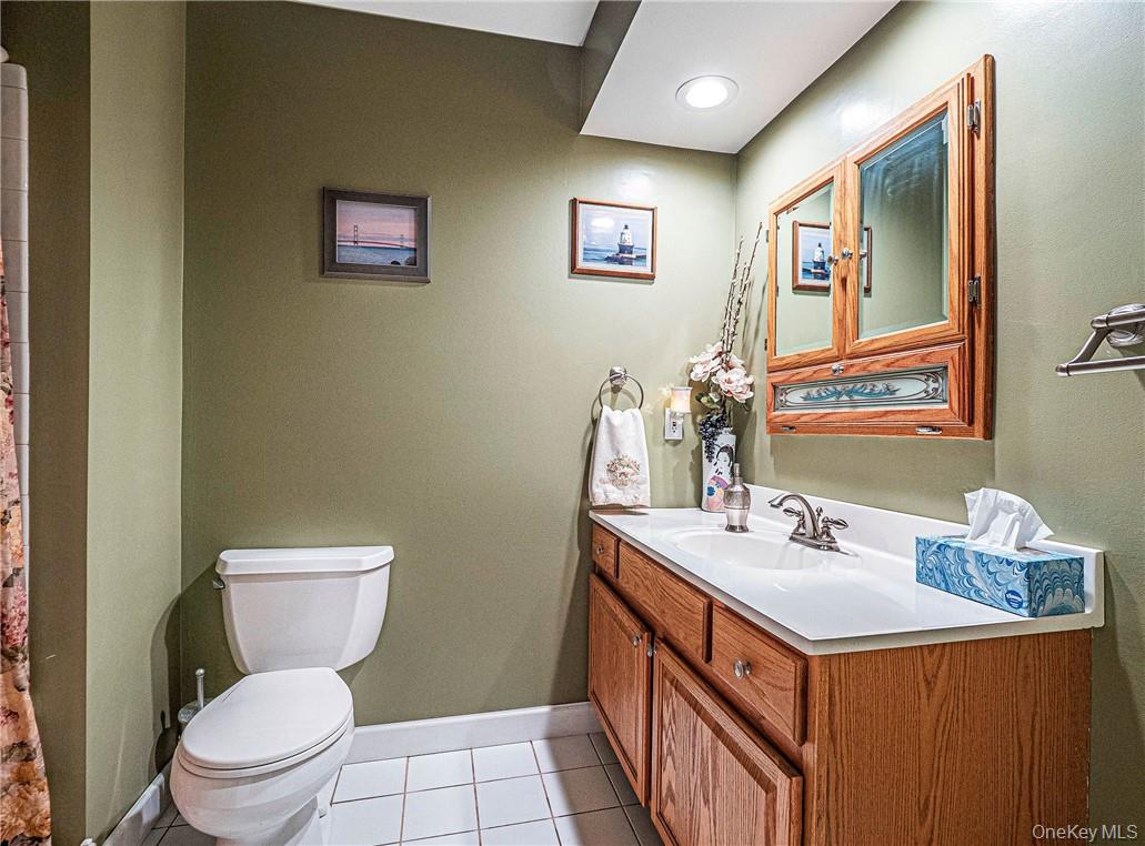 26 Waterbury Road Warwick, NY 10990 - Photo 18 of 30 a bathroom with a sink mirror vanity and toilet