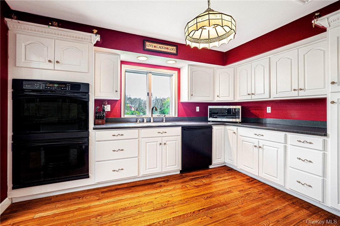 26 Waterbury Road Warwick, NY 10990 - Photo 9 of 30 a kitchen with stainless steel appliances granite countertop a stove a sink and a microwave