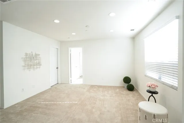 a view of an empty room and window