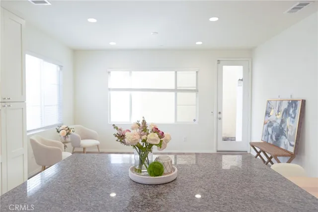 a living room with furniture potted plant