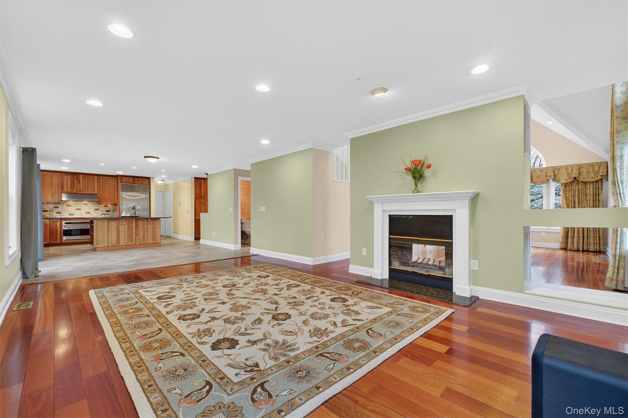 45 East Hill Road Cortlandt Manor, NY 10567 - Photo 13 of 48 a living room with a rug and a fireplace