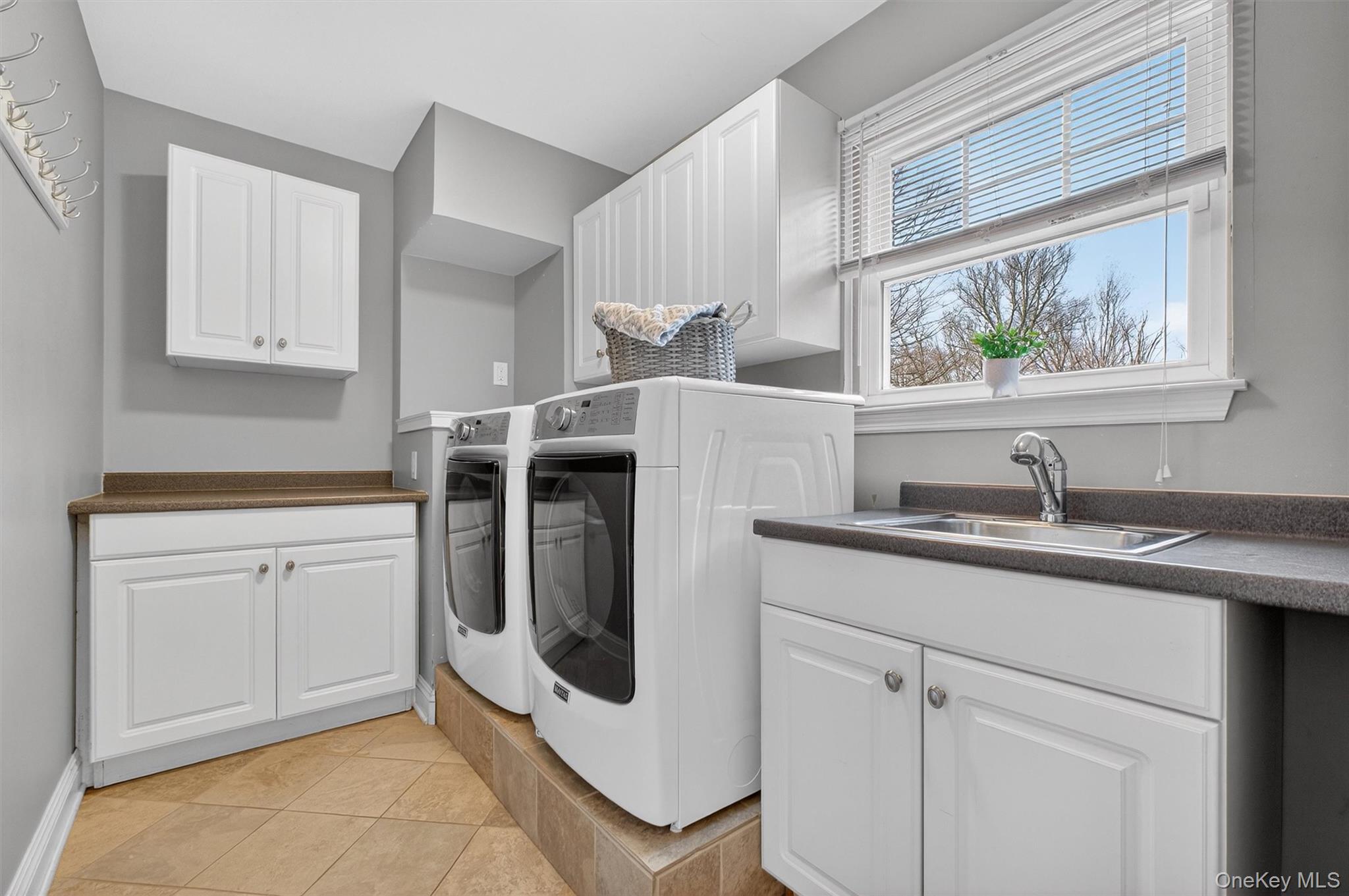 45 East Hill Road Cortlandt Manor, NY 10567 - Photo 16 of 48 a kitchen with a sink cabinets and window