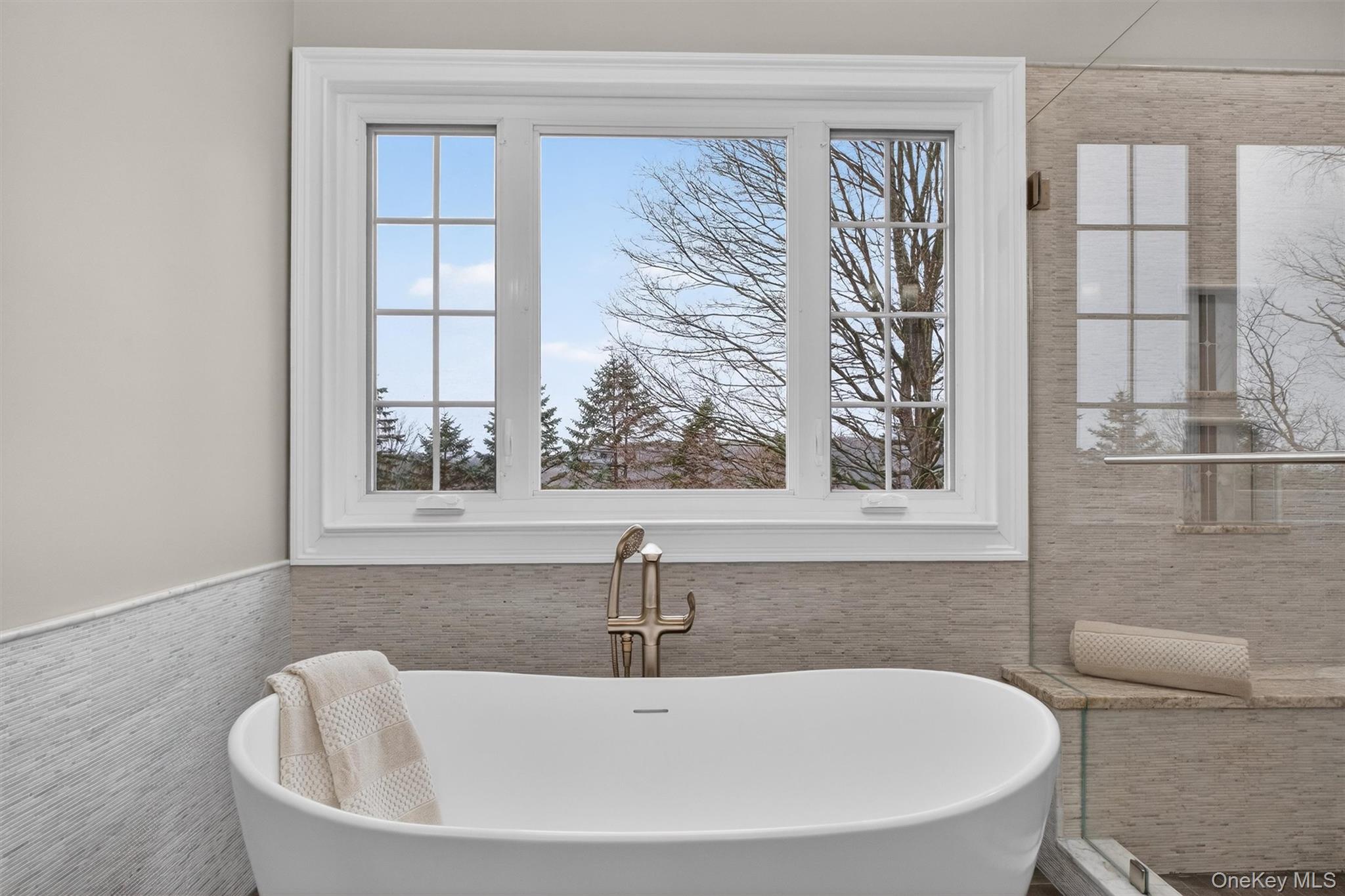 45 East Hill Road Cortlandt Manor, NY 10567 - Photo 21 of 48 a white bath tub sitting next to a window