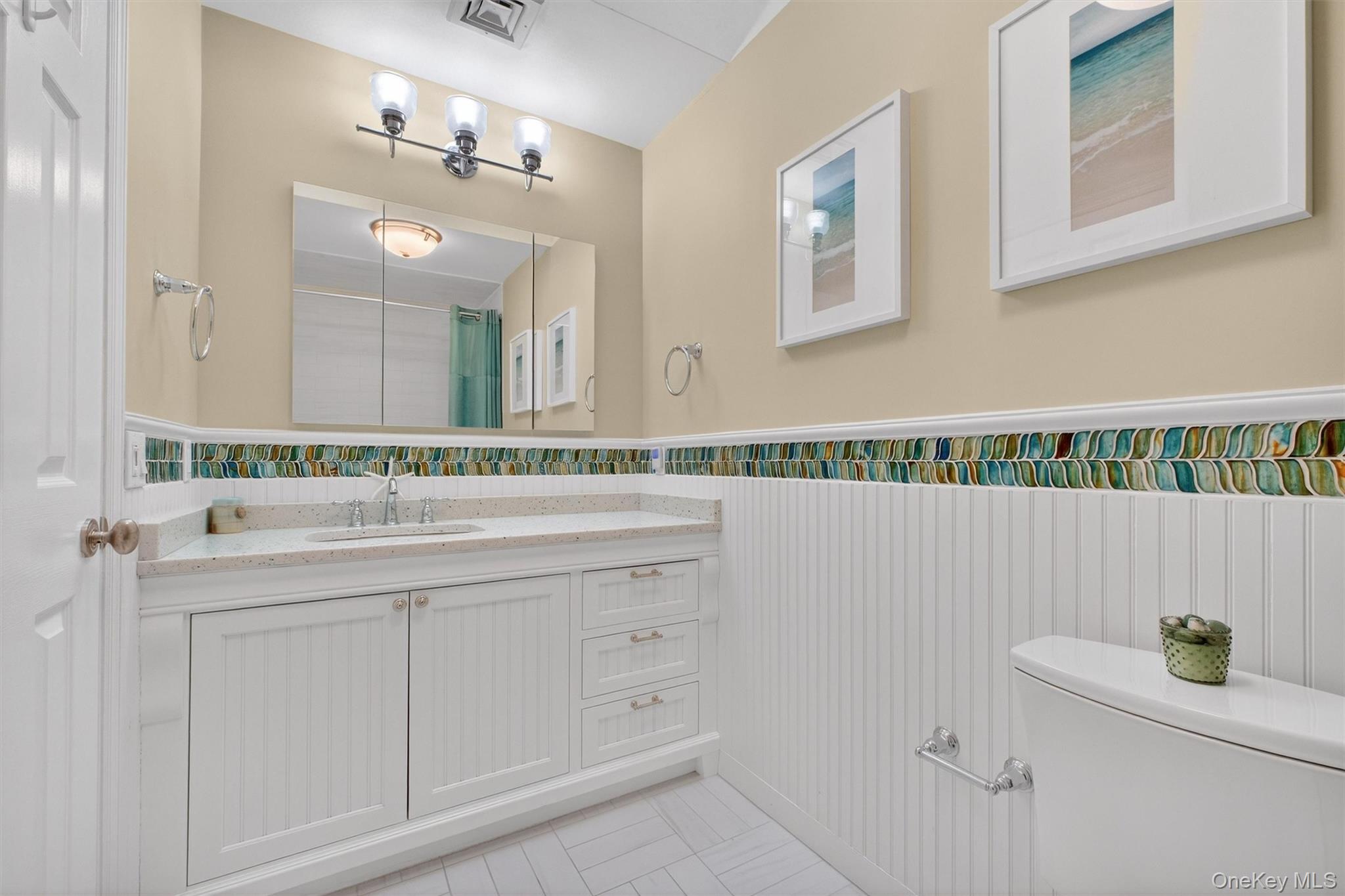 45 East Hill Road Cortlandt Manor, NY 10567 - Photo 23 of 48 a bathroom with a sink and a mirror