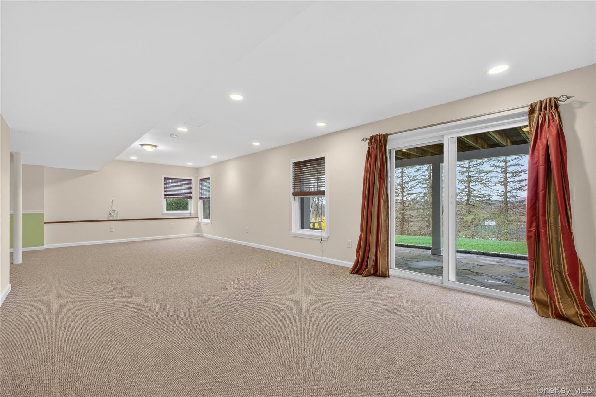 45 East Hill Road Cortlandt Manor, NY 10567 - Photo 30 of 48 a view of empty room with floor to ceiling window and wooden floor