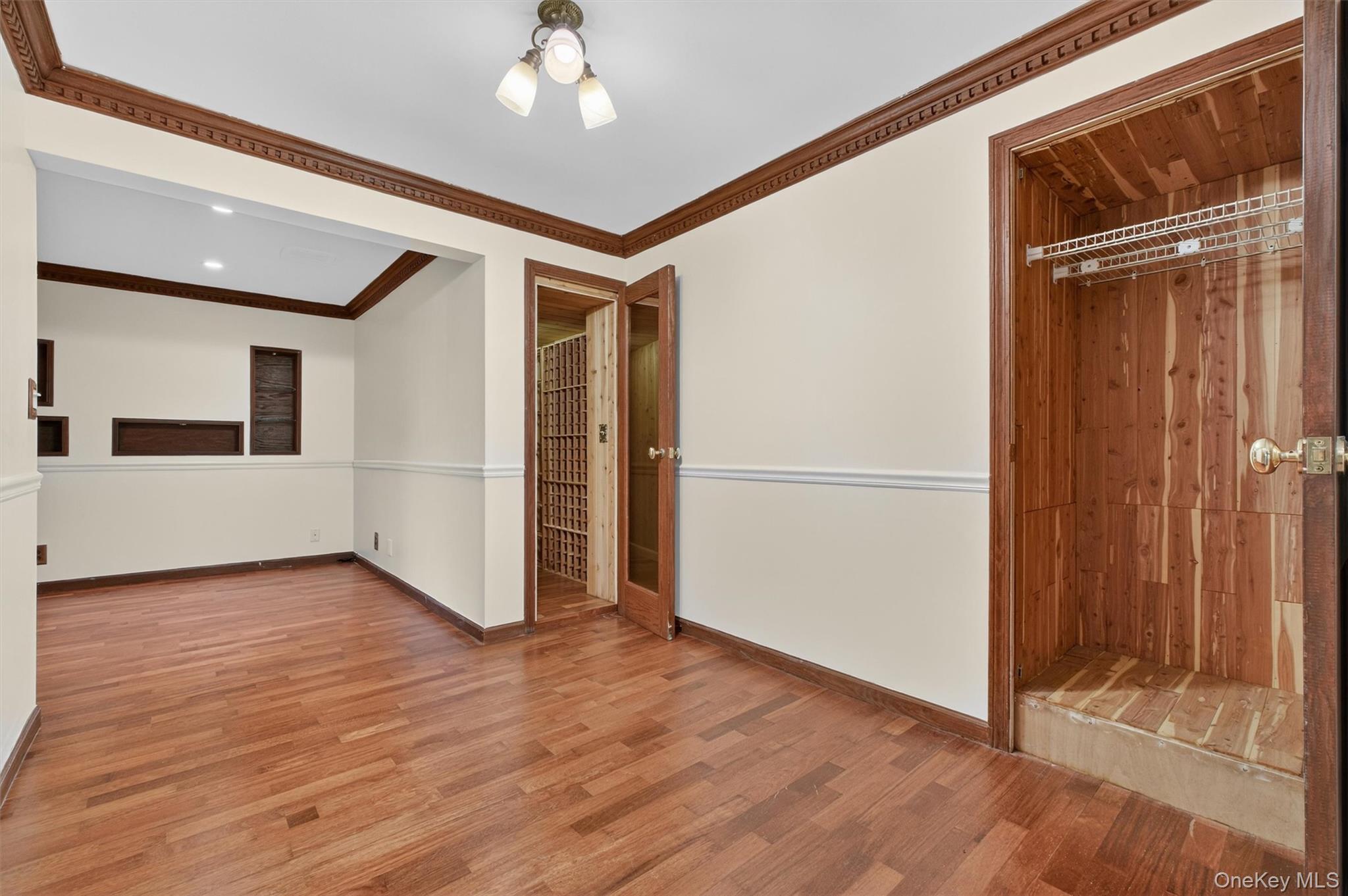 45 East Hill Road Cortlandt Manor, NY 10567 - Photo 31 of 48 a view of a livingroom with wooden floor staircase and a kitchen space