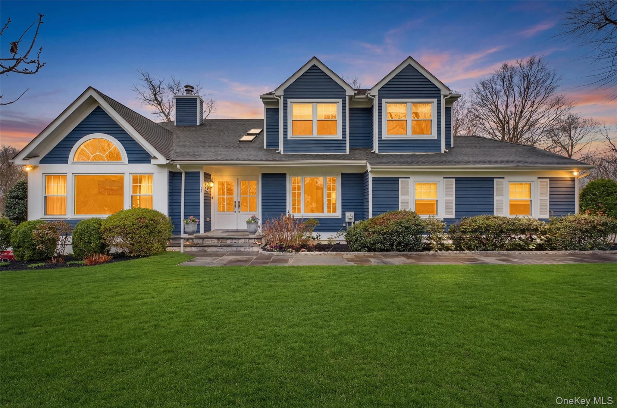 45 East Hill Road Cortlandt Manor, NY 10567 - Photo 40 of 48 a front view of a house with a yard