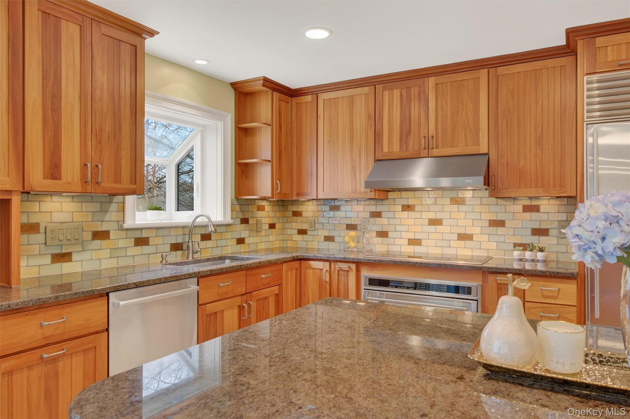 45 East Hill Road Cortlandt Manor, NY 10567 - Photo 7 of 48 a kitchen with stainless steel appliances granite countertop a sink a stove and a microwave