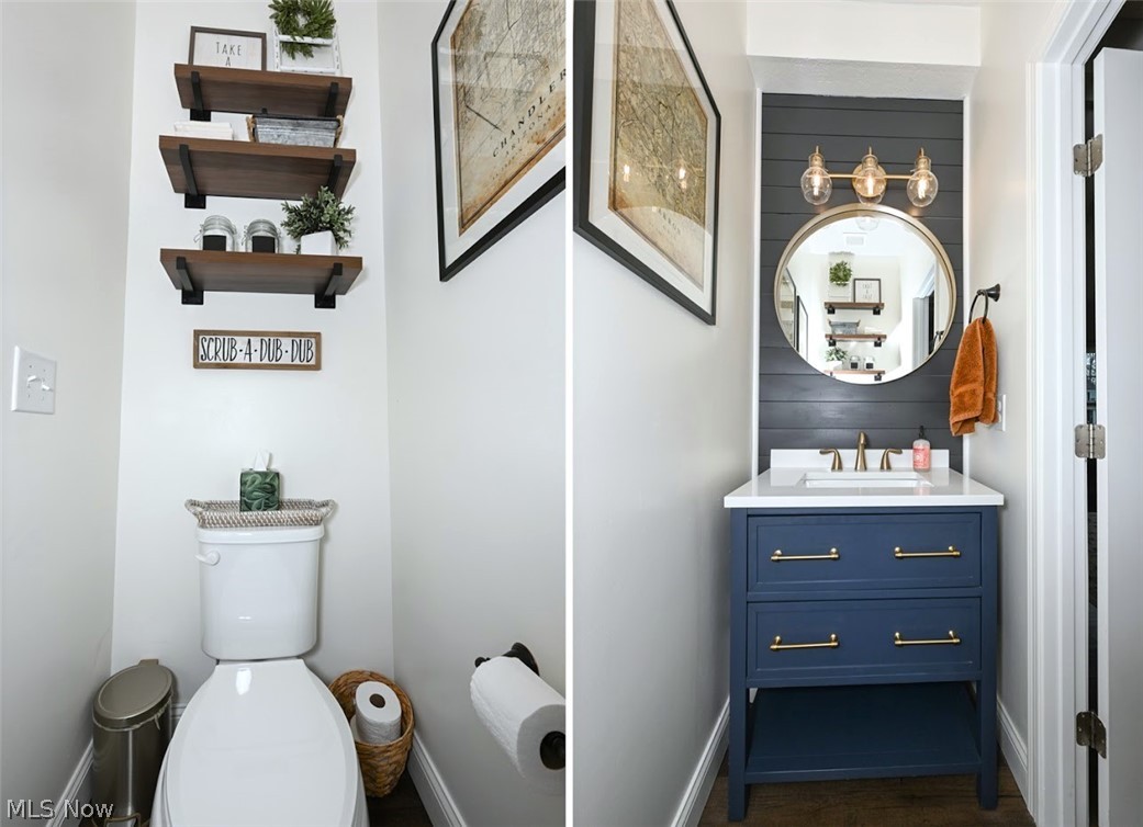 3021 Stonehurst Road Uniontown, OH 44685 - Photo 21 of 48 *2 VERTICAL PHOTOS OF EACH SIDE OF THE HALF BATHROOM. BLACK ACCENT SHIPLAP WALL, MODERN GOLD TRIPLE SCONCE LIGHTING, GOLD RECESSED MIRROR, NAVY VANITY, UPGRADED FLOORING, BUILT IN MATCHING STAINED FLOATING SHELVES ~