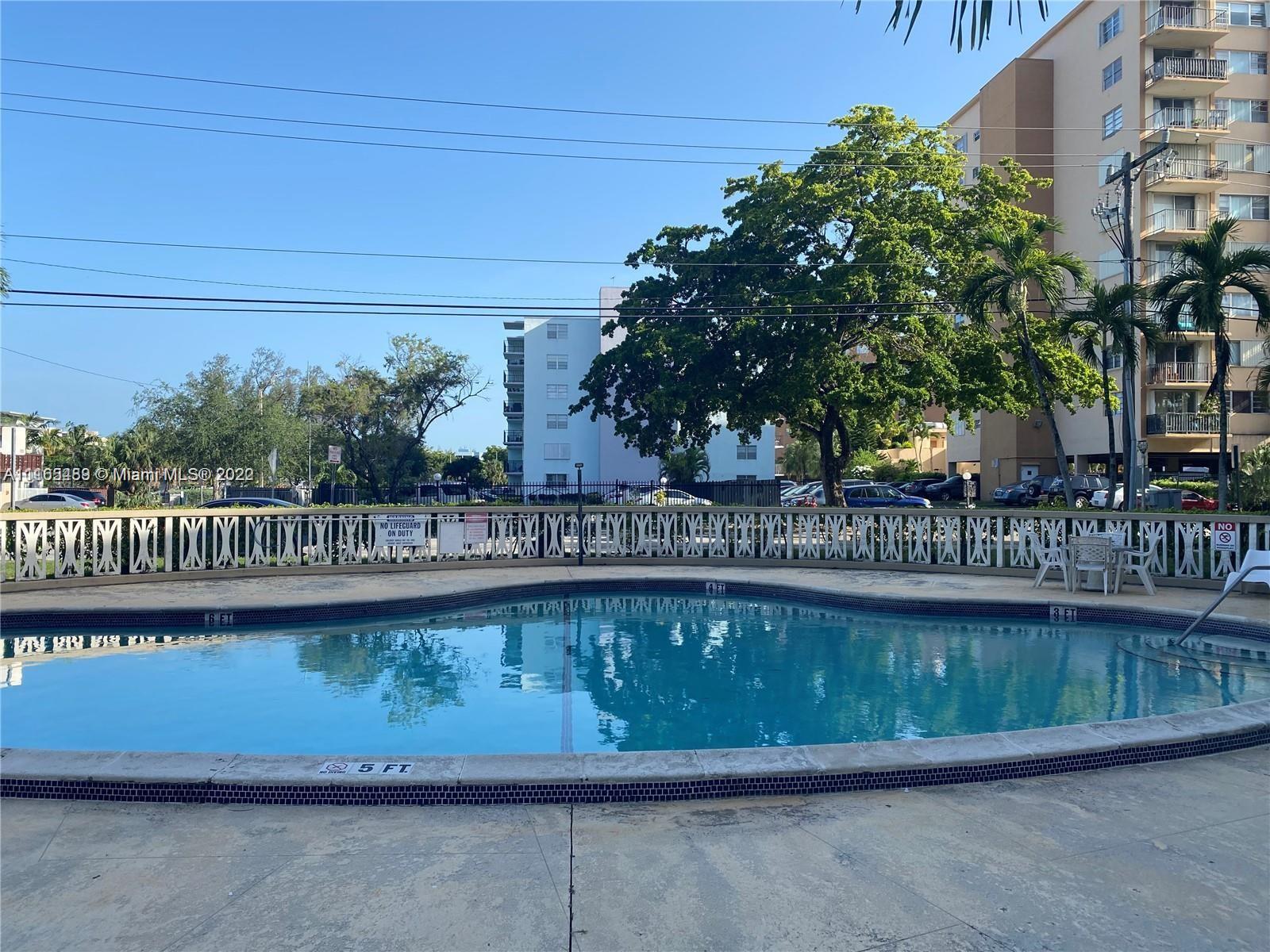 a view of a swimming pool and outdoor space