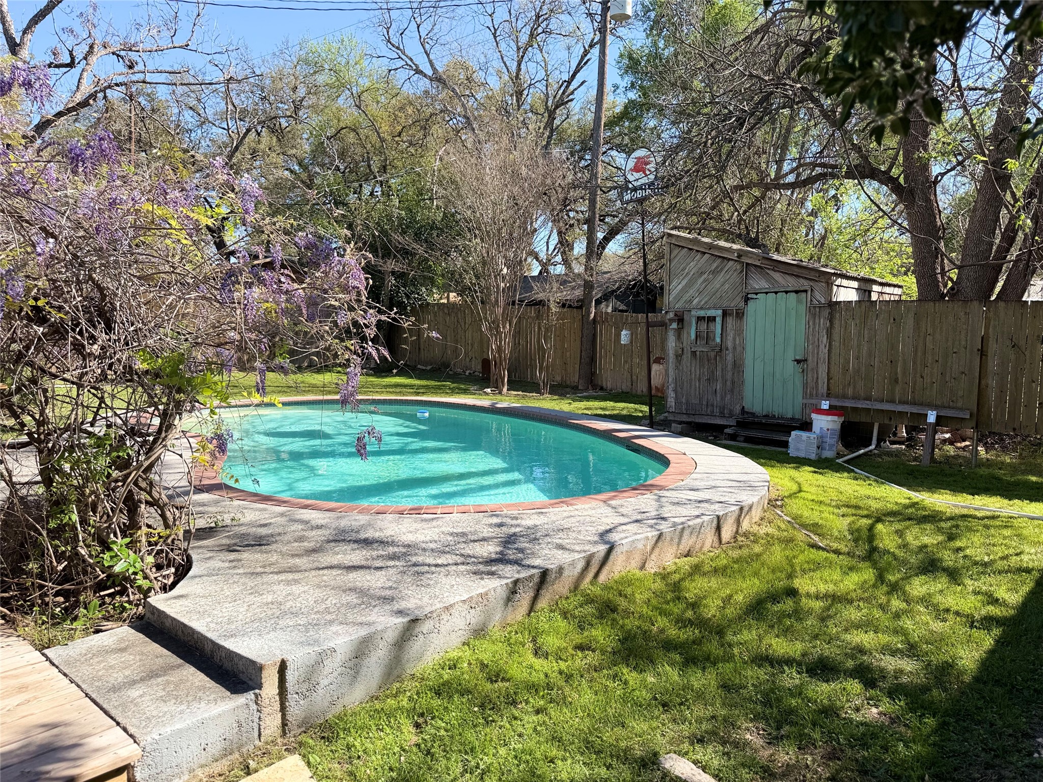 301 Sheraton Avenue Austin, TX 78745 - Photo 12 of 27 Behind the pool, theres a charming little shed with a true South Austin vibe, perfect as a workshop, man-cave, she-shed, or even a future greenhouse.
