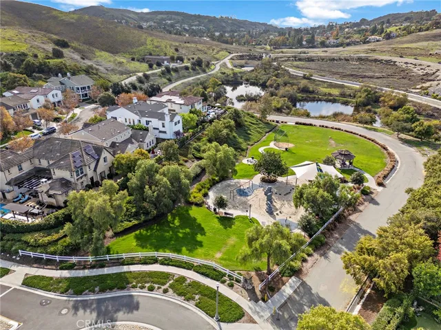 an aerial view of a house swimming pool and outdoor seating