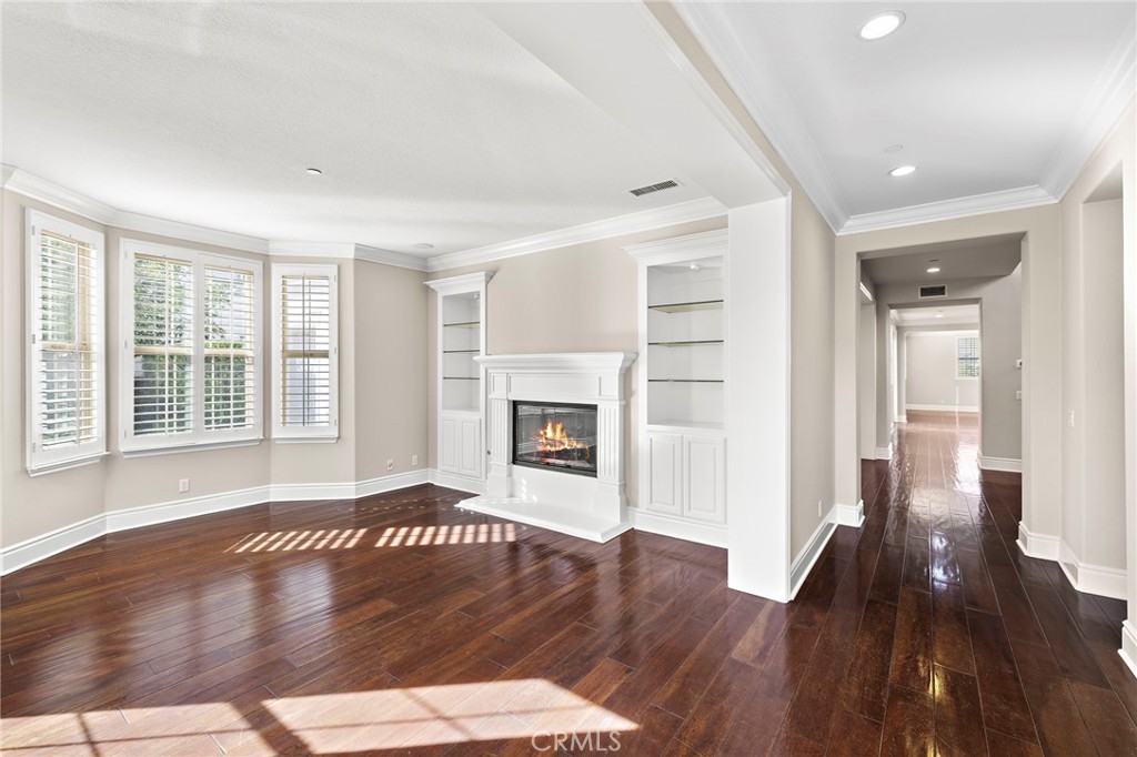 3 Eric Street Ladera Ranch, CA 92694 - Photo 6 of 35 an empty room with wooden floor and fireplace