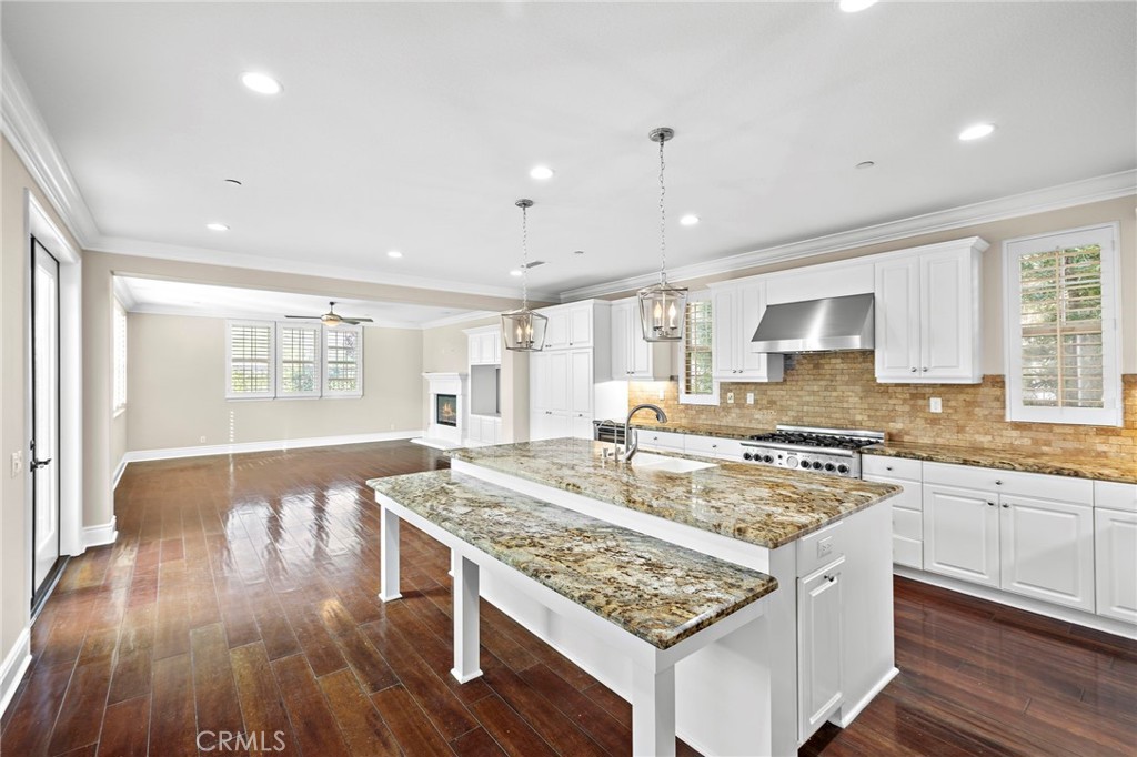 3 Eric Street Ladera Ranch, CA 92694 - Photo 9 of 35 a kitchen with a stove sink and cabinets