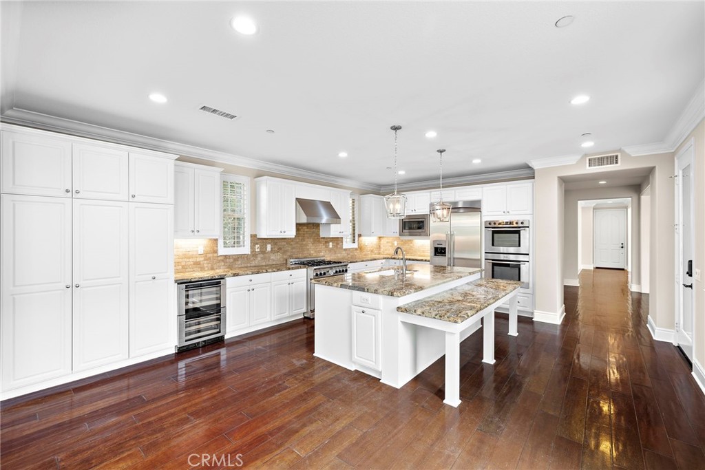 3 Eric Street Ladera Ranch, CA 92694 - Photo 10 of 35 a large kitchen with a table and chairs in it