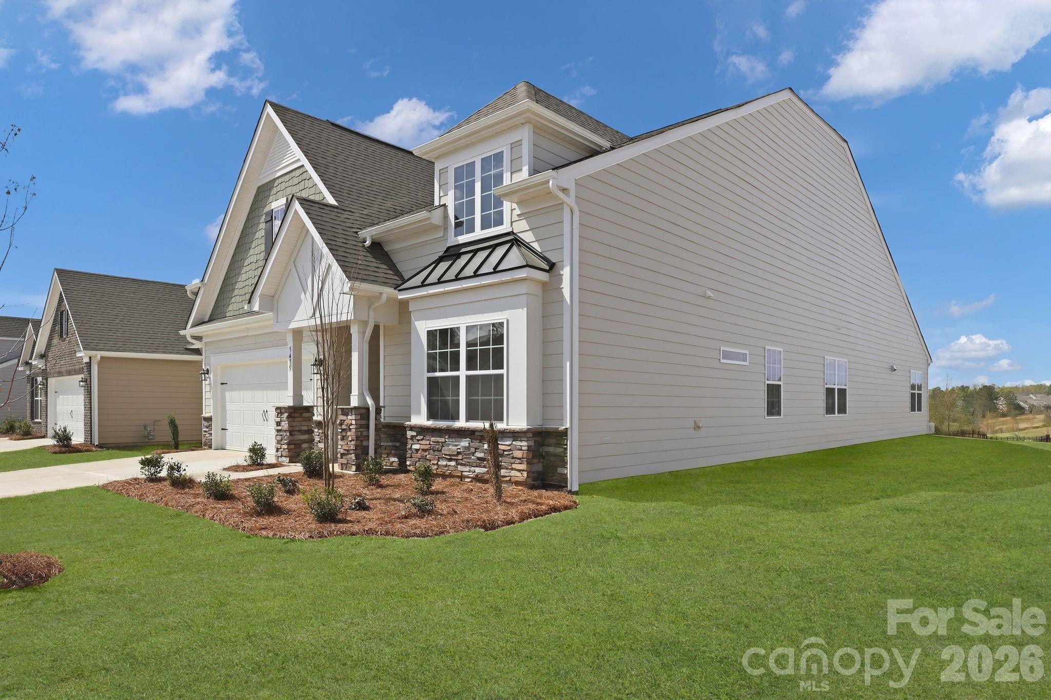 5475 Redbud Road, Unit 57 Lancaster, SC 29720 - Photo 2 of 30 a view of a house with a yard porch and sitting area