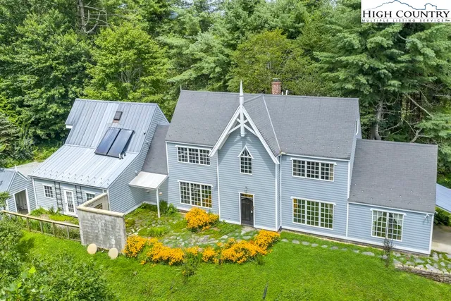 aerial view of a house with a yard