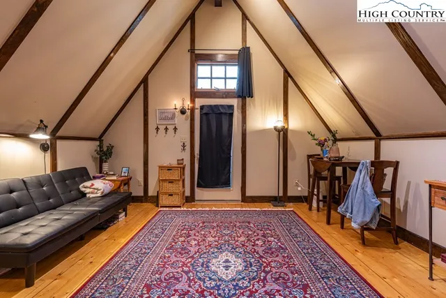 a living room with furniture and a rug