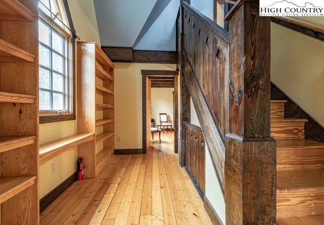 a view of a house with wooden floor and stairs
