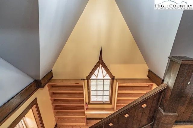 a view of entryway with wooden floor and stairs