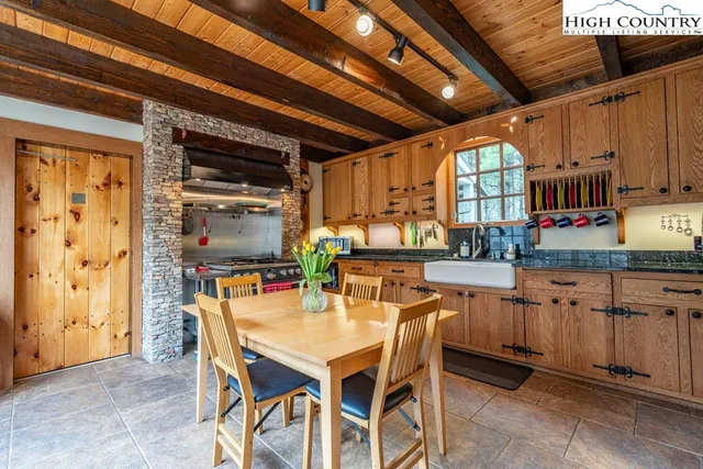 a dining room with furniture and window