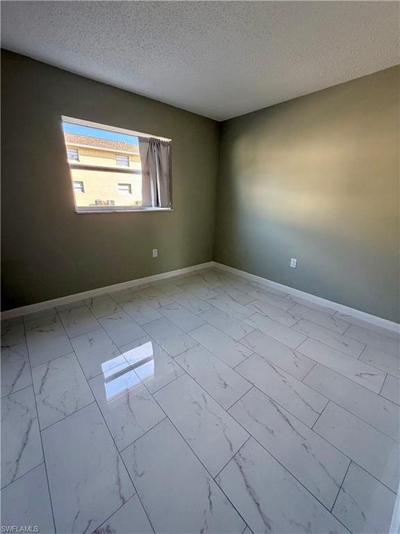 3325 Airport Road North, Unit N3 Naples, FL 34105 - Photo 11 of 12 an empty room with windows