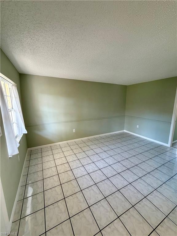 3325 Airport Road North, Unit N3 Naples, FL 34105 - Photo 6 of 12 a view of an empty room and window