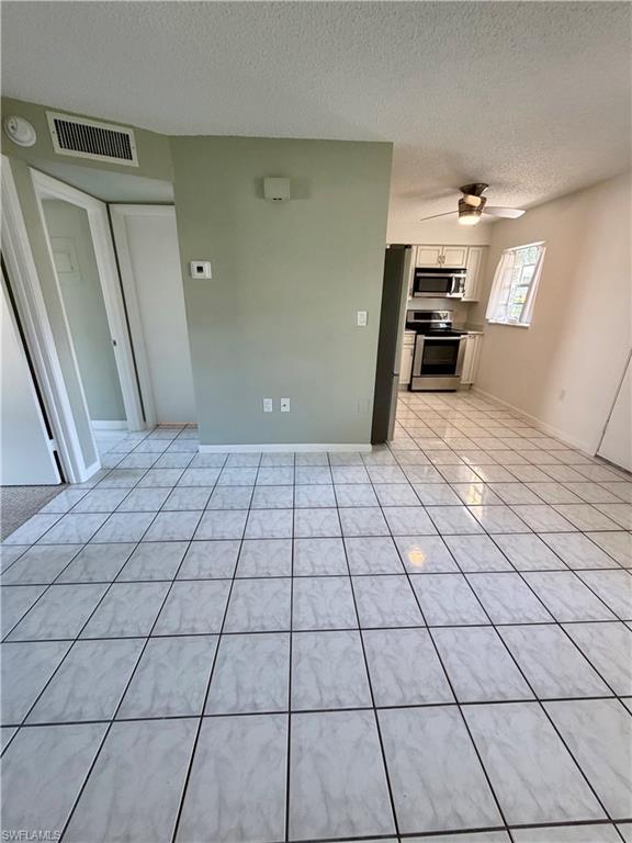 3325 Airport Road North, Unit N3 Naples, FL 34105 - Photo 7 of 12 a view of a livingroom with kitchen and furniture