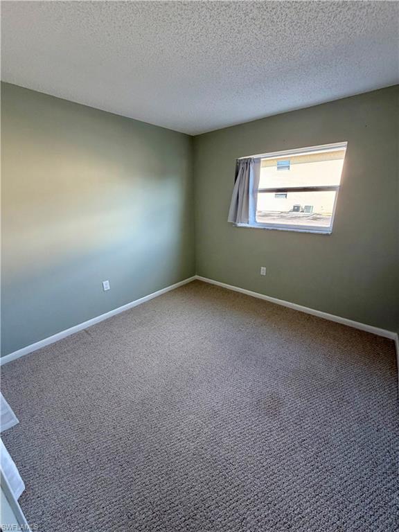 3325 Airport Road North, Unit N3 Naples, FL 34105 - Photo 9 of 12 an empty room with a window