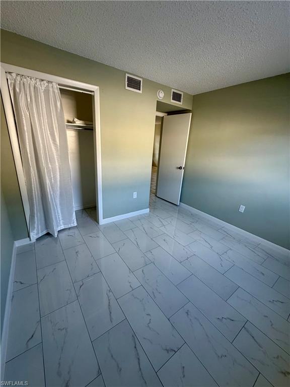 3325 Airport Road North, Unit N3 Naples, FL 34105 - Photo 10 of 12 an empty room with a natural light