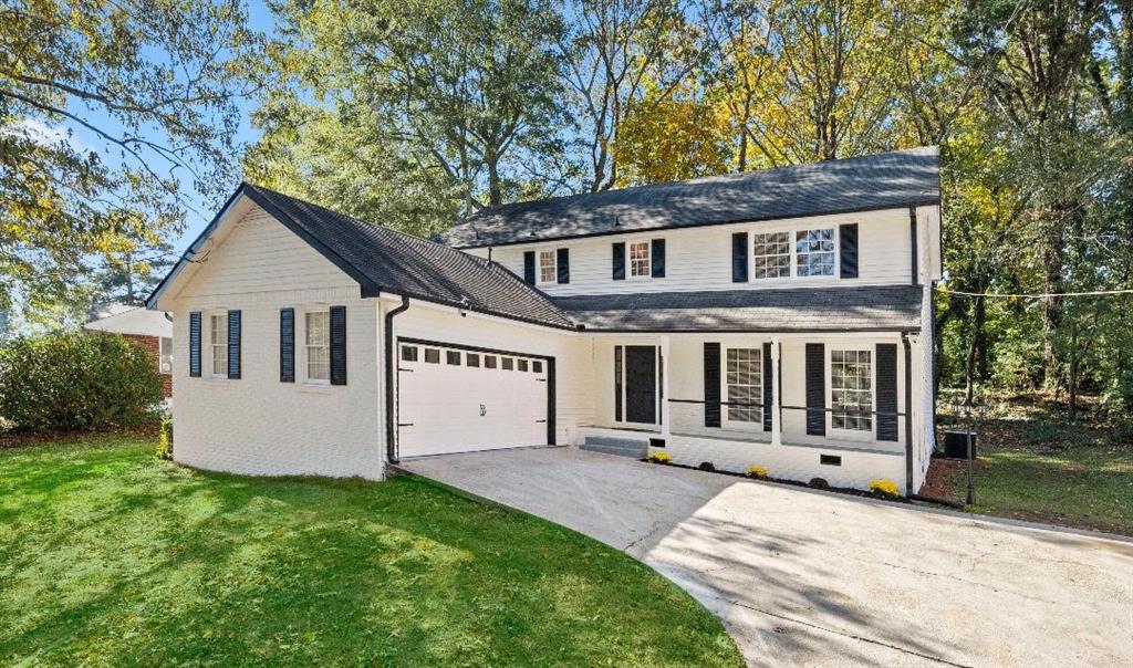 2145 Tudor Castle Way Decatur, GA 30035 - Photo 1 of 1 a front view of a house with a yard