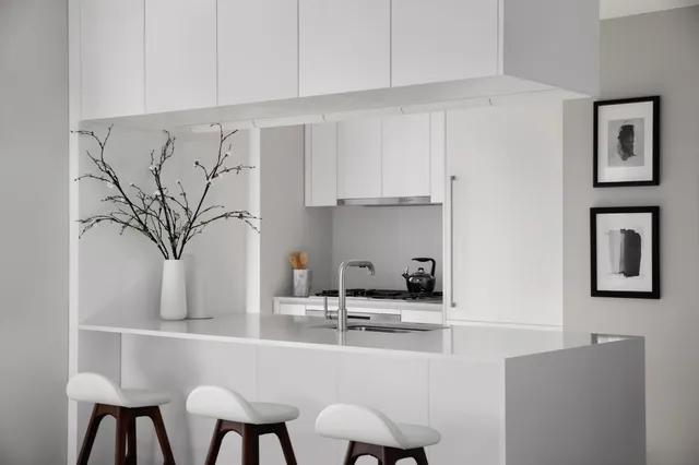 a kitchen with stainless steel appliances a sink and a cabinets