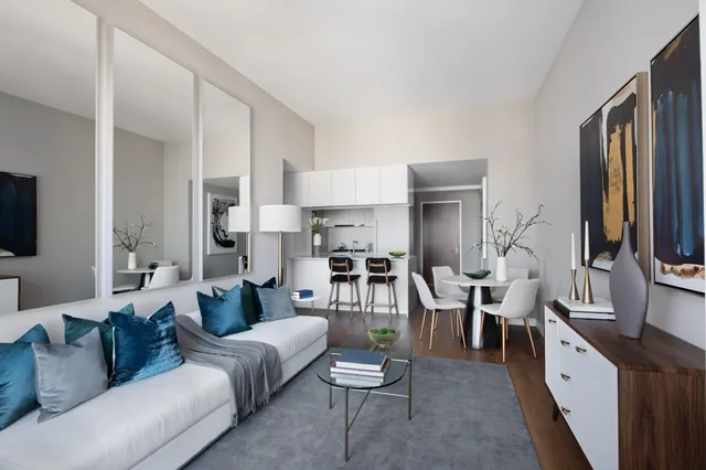 a living room with furniture flat screen tv and white walls