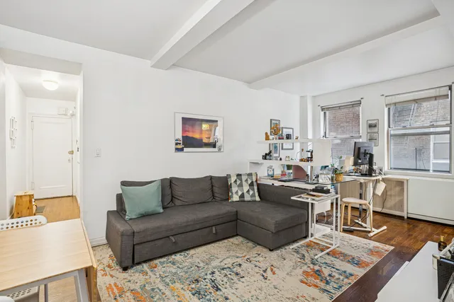 a living room with furniture and a rug