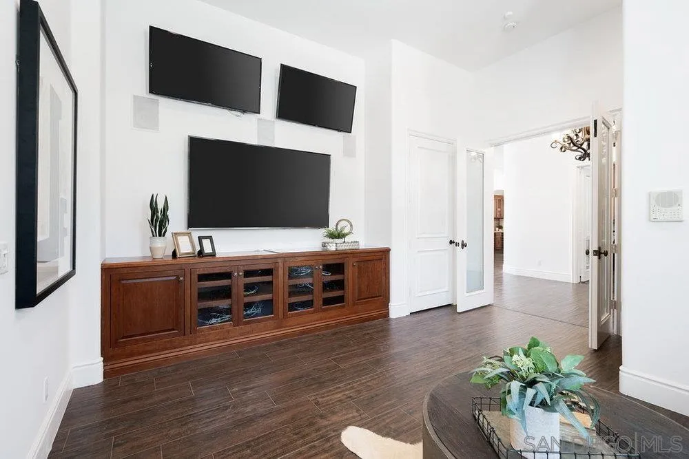 17864 Old Winemaster Way Poway, CA 92064 - Photo 18 of 22 a living room with furniture and a flat screen tv