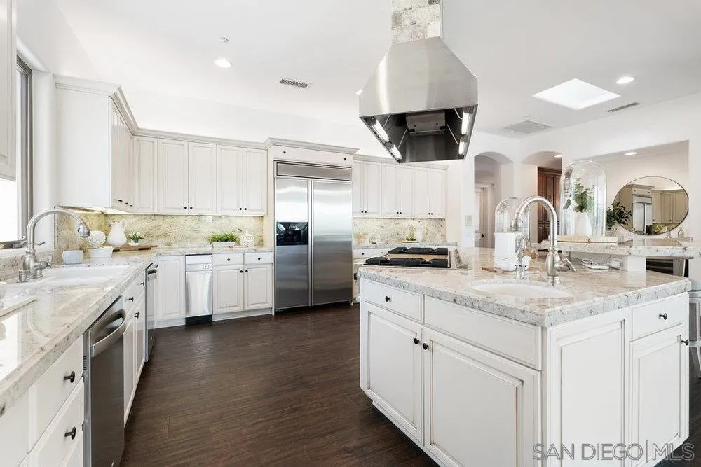 17864 Old Winemaster Way Poway, CA 92064 - Photo 7 of 22 a kitchen with a sink stove and cabinets