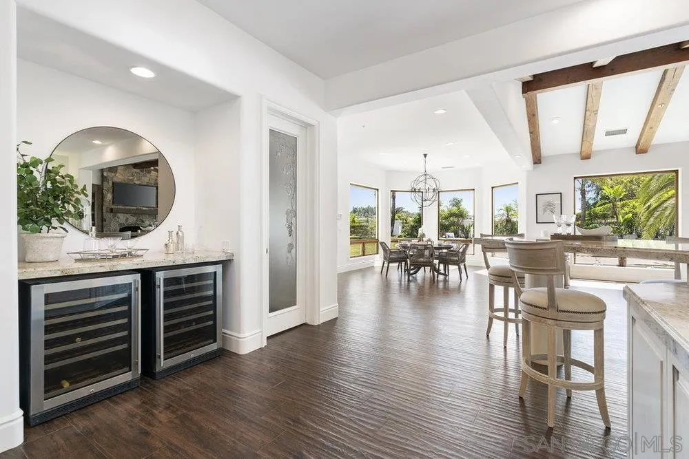 17864 Old Winemaster Way Poway, CA 92064 - Photo 8 of 22 a view of kitchen with furniture and wooden floor