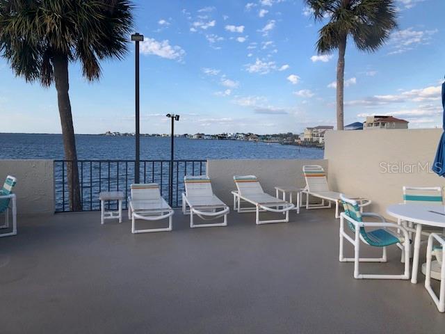 6035 Sea Ranch Drive, Unit 211 Hudson, FL 34667 - Photo 4 of 21 a view of a terrace with furniture and city view
