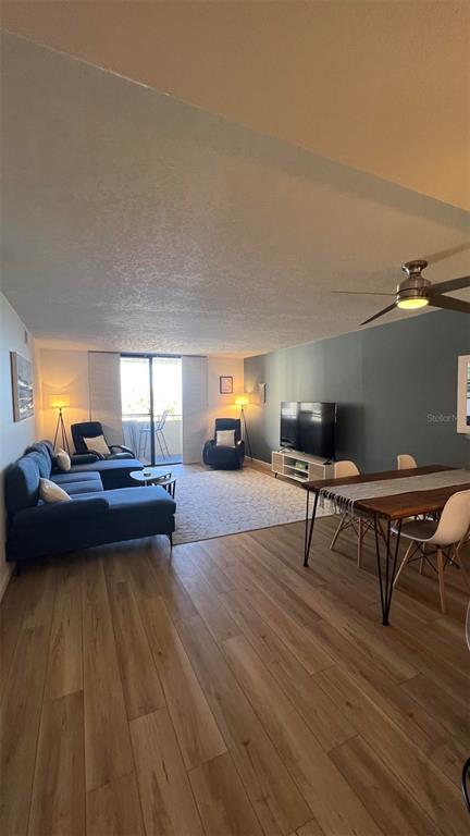 6035 Sea Ranch Drive, Unit 211 Hudson, FL 34667 - Photo 8 of 21 a living room with furniture and a rug