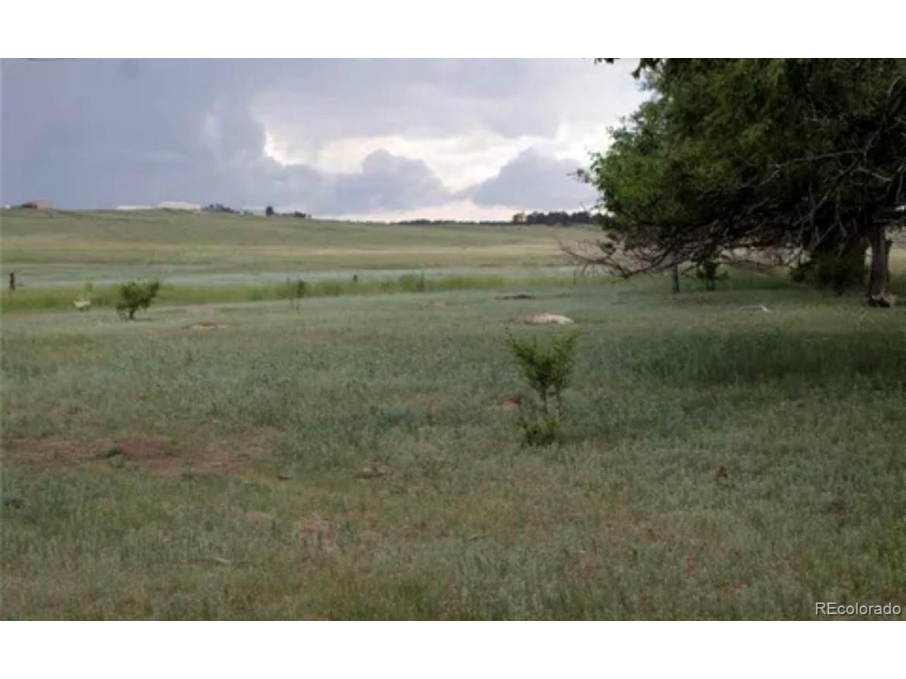 16 Sweet Road Calhan, CO 80808 - Photo 2 of 9 a view of a lake with a big yard