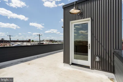 a view of a balcony with floor to ceiling window and floor to ceiling window